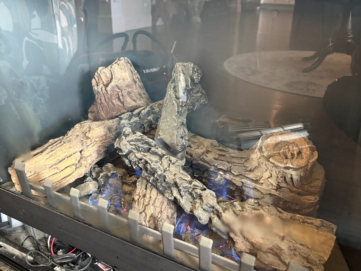 A gas log set burning clean after service by XFire Solution